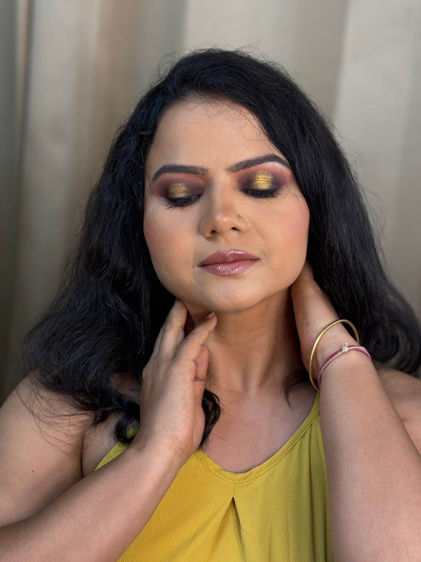 Party makeup with golden eyeshadow and nude lips, Faridabad