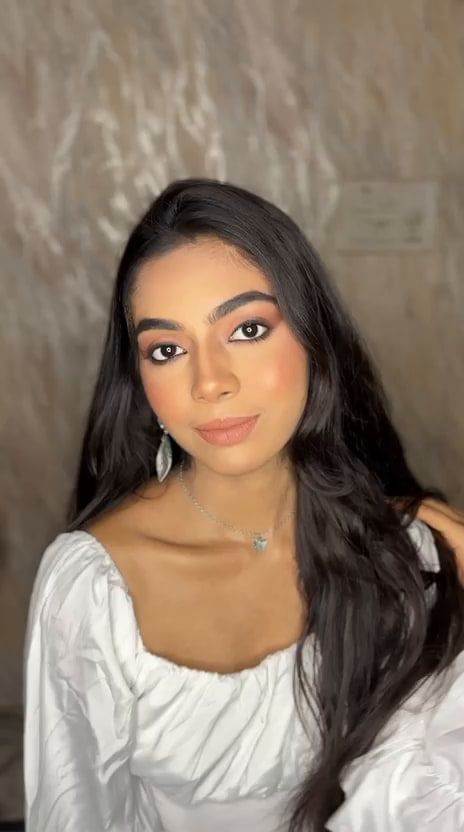 Natural soft-glam party makeup with warm brown eyes and nude lips